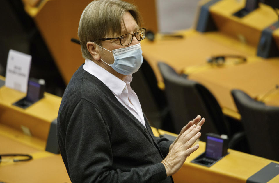 FILE - In this May 27, 2020, file photo, member of the European Parliament Guy Verhofstadt speaks as he wears a face mask, to protect against the coronavirus, during the plenary at the European Parliament in Brussels. The European Union still hasn't completely sorted out its messy post-divorce relationship with Britain — but it has already been plunged into another major crisis. This time the 27-member union is being tested as Poland and Hungary block passage of its budget for the next seven years and an ambitious package aimed at rescuing economies ravaged by the coronavirus pandemic. (AP Photo/Olivier Matthys, File)