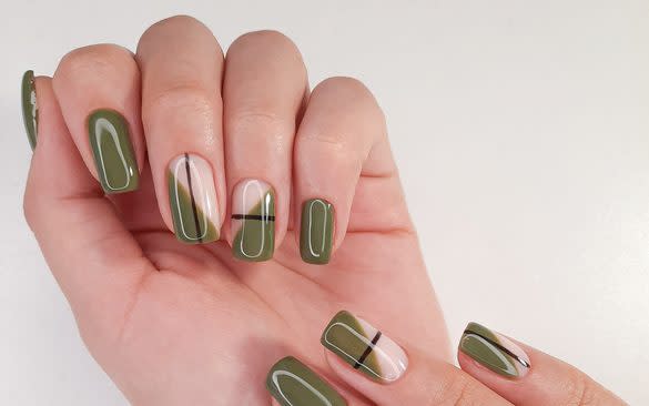 Olive green and black short acrylic nails.