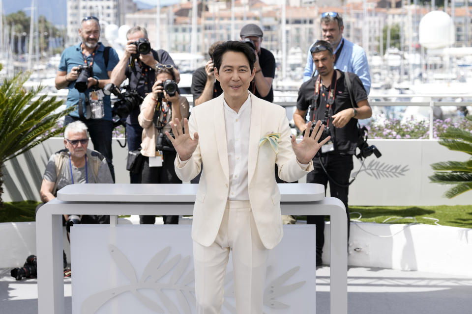 Lee Jung-jae poses for photographers at the photo call for the film 'Hunt' at the 75th international film festival, Cannes, southern France, Thursday, May 19, 2022. (Photo by Joel C Ryan/Invision/AP)