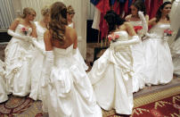 <p>Debutantes check their gowns before entering the Grand Ballroom of the Waldorf Astoria hotel for the 52nd International Debutante Ball, Dec. 29, 2006, in New York. (Photo: Mike Segar/Reuters) </p>