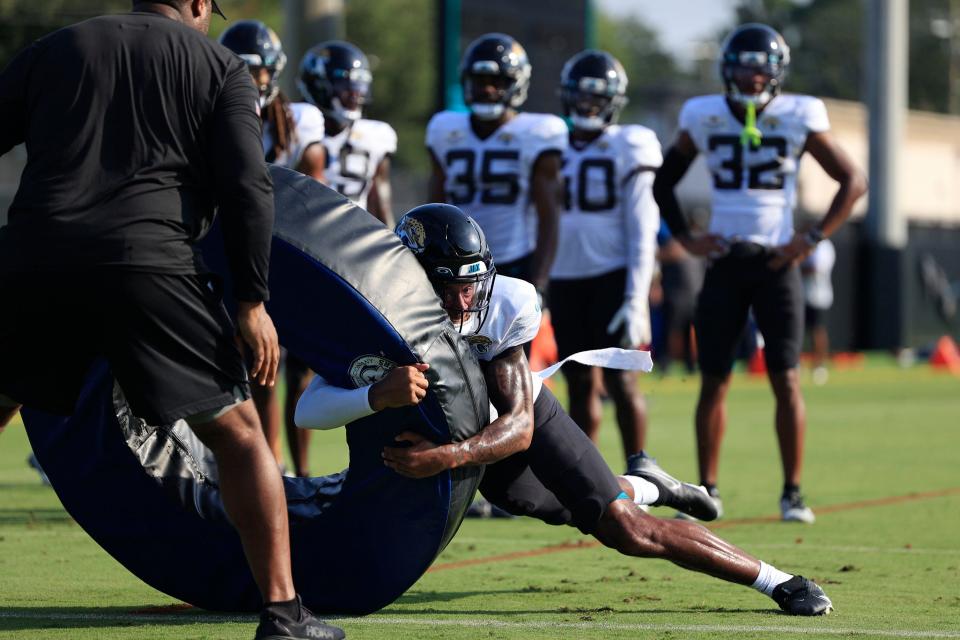 Jacksonville Jaguars safety Antonio Johnson (26) hits a tackling ring Tuesday, Aug. 1, 2023 at Miller Electric Center at EverBank Stadium in Jacksonville, Fla. Today marked the first padded practice. 