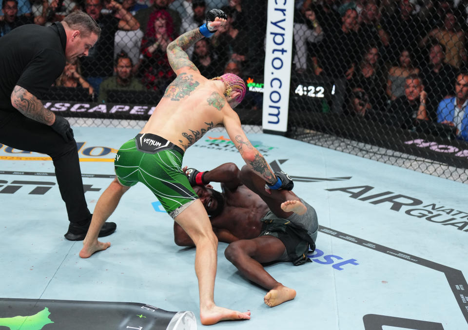 BOSTON, MASSACHUSETTS - AUGUST 19: (L-R) Sean O'Malley punches Aljamain Sterling in the UFC bantamweight championship fight during the UFC 292 event at TD Garden on August 19, 2023 in Boston, Massachusetts. (Photo by Cooper Neill/Zuffa LLC via Getty Images)