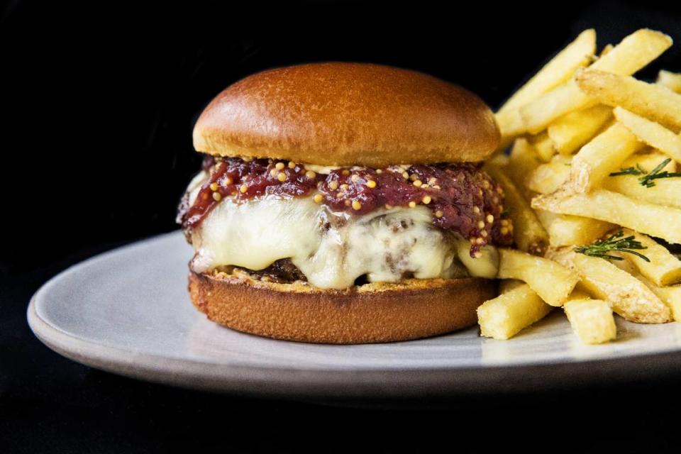 The house burger at the Cellar Bar at The Elderberry House is made with raclette cheese and an onion jam.