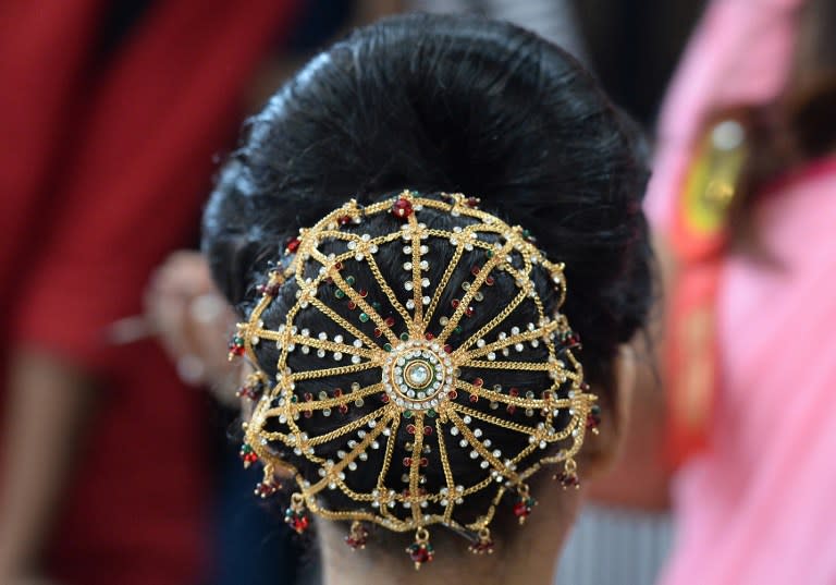 <p>A hair style fashioned by an Indian professional hair stylist is pictured at the 7th International Beauty and Spa Expo in New Delhi on June 28, 2016. The expo is billed as India’s largest beauty products trade show. </p>