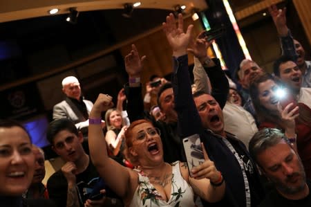 Supporters of Miriam Gutierrez "La Reina", 36, react as she defeats Samantha Smith for the lightweight European Championship in Torrelodones