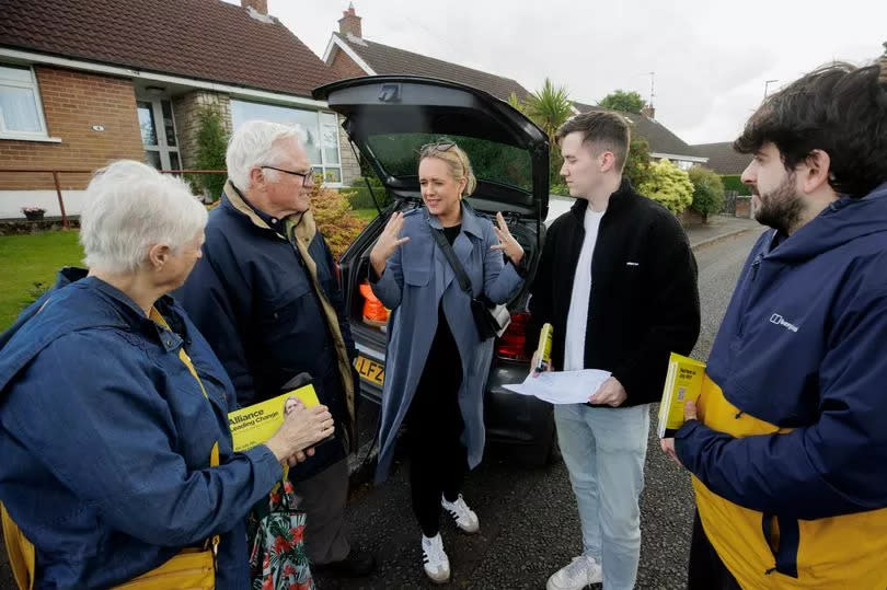 Kate Nicholl (centre), Alliance Westminster candidate for the constituency of South Belfast and Mid Down, speaking with her canvassing team in the Four Winds area