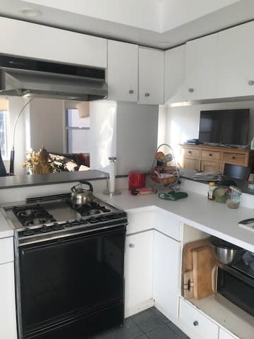 Before: While an all-white scheme makes a space feel more open, the white cabinetry in the previous iteration made the kitchen feel dull.