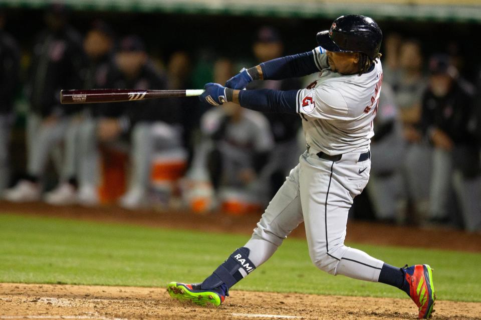 Cleveland Guardians third baseman José Ramírez follows through on his ninth-inning RBI triple, March 28, 2024, in Oakland.