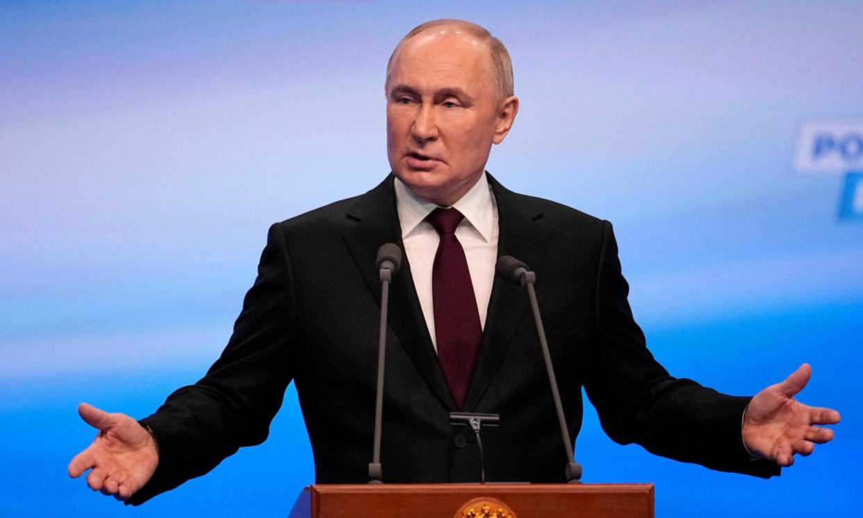 <span>Vladimir Putin giving a speech at his campaign headquarters in Moscow on Sunday evening.</span><span>Photograph: Alexander Zemlianichenko/AP</span>