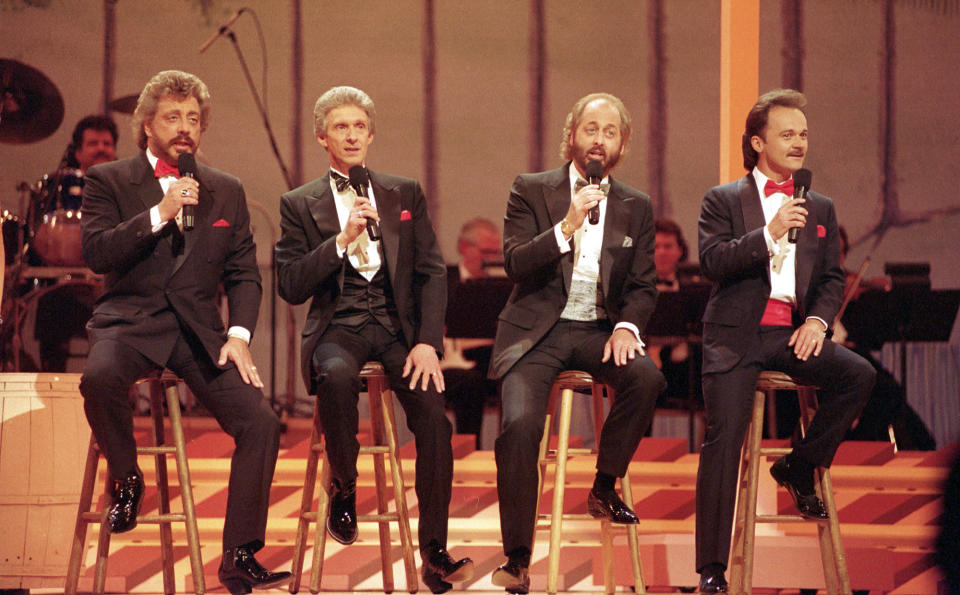 FILE - In this May 7, 1992, file photo, The Statler Brothers, from left, Harold Reid, Phil Balsley, Don Reid, and Jimmy Fortune, perform in Nashville, Tenn. Harold Reid, who sang bass for the Grammy-winning country group The Statler Brothers, died Friday, April 24, 2020, after a long battle with kidney failure. He was 80. (AP Photo/File)