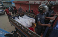 <p>Bangladesh policemen drive off in a mini truck with bodies of suspected militants after a raid in Narayanganj district near Dhaka, Bangladesh, Saturday, Aug.27, 2016. (AP Photo) </p>