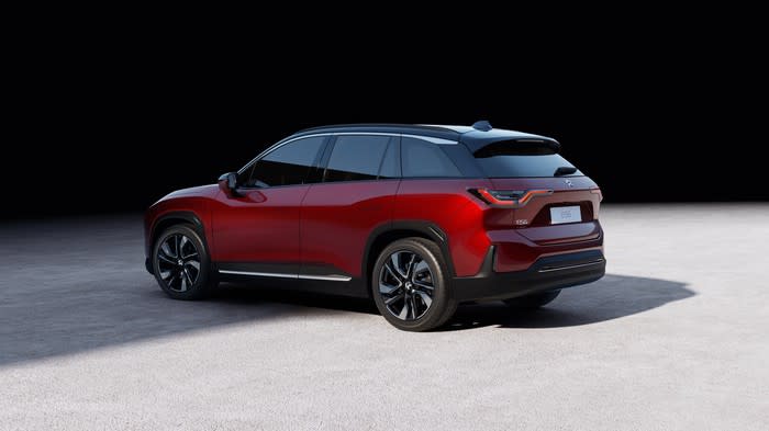 A red NIO ES6, a sleek midsize SUV.