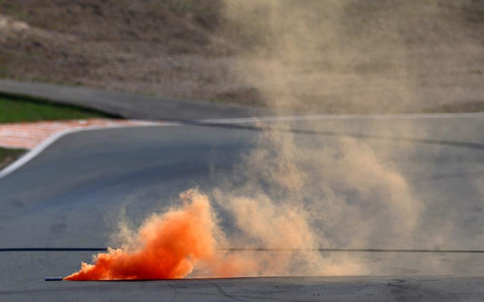 ZANDVOORT, NETHERLANDS - SEPTEMBER 03: An orange flare is pictured on the track during qualifying ahead of the F1 Grand Prix of The Netherlands at Circuit Zandvoort on September 03, 2022 in Zandvoort, Netherlands. - Lars Baron/Formula 1