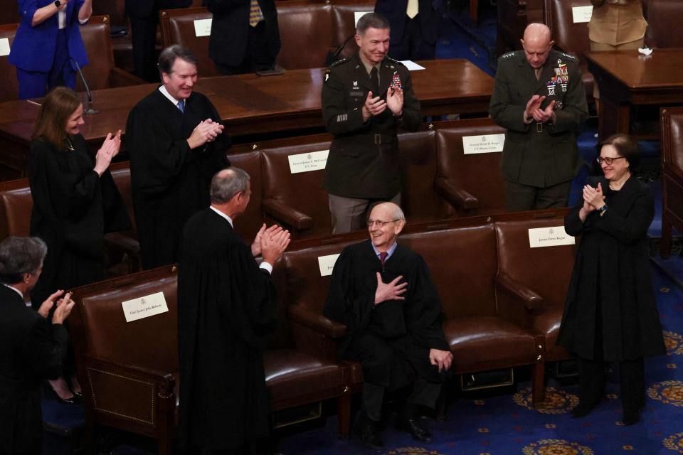 Chief Justice John Roberts and Associate Justices Amy Coney Barrett, Brett Kavanaugh and Elena Kagan as well as US Army Chief of Staff General James McConville and US Marines Chief of Staff General David Berger applaud retiring Supreme Court Justice Stephen Breyer as Breyer is honored by President Joe Biden during the State of the Union address on March 1, 2022.