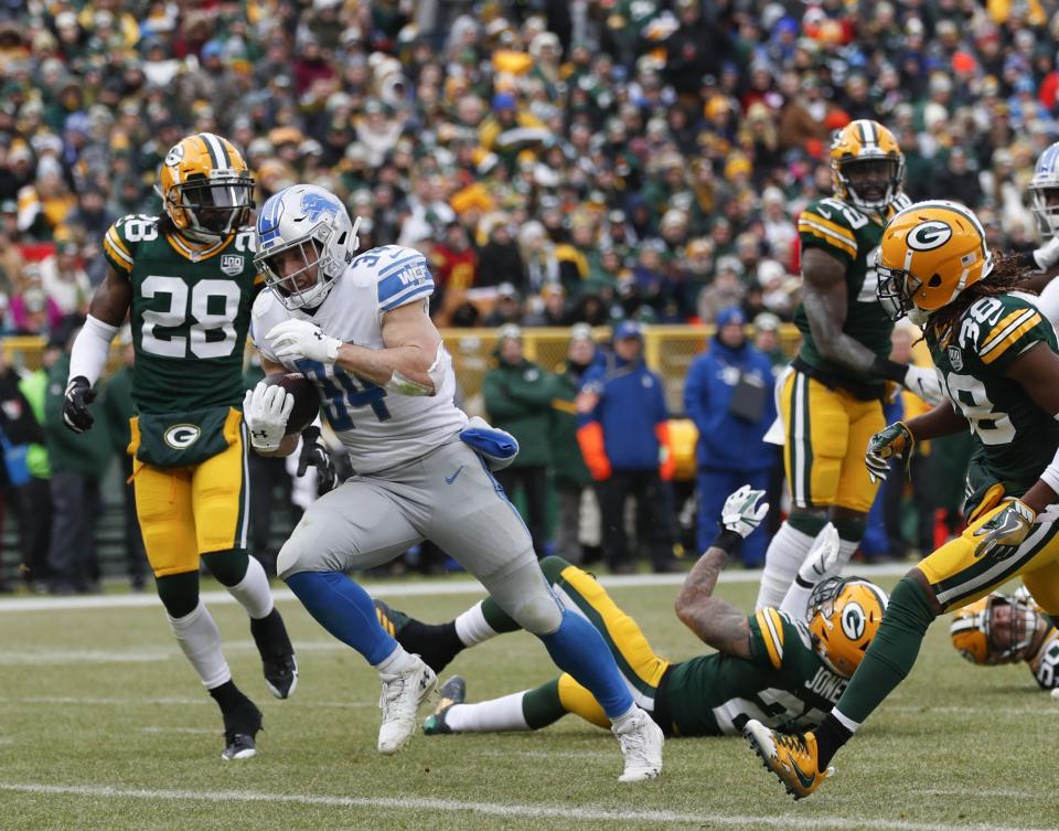 Detroit Lions' Zach Zenner runs for a touchdown during the first half of an NFL football game against the Green Bay Packers Sunday, Dec. 30, 2018, in Green Bay, Wis. (AP Photo/Matt Ludtke)