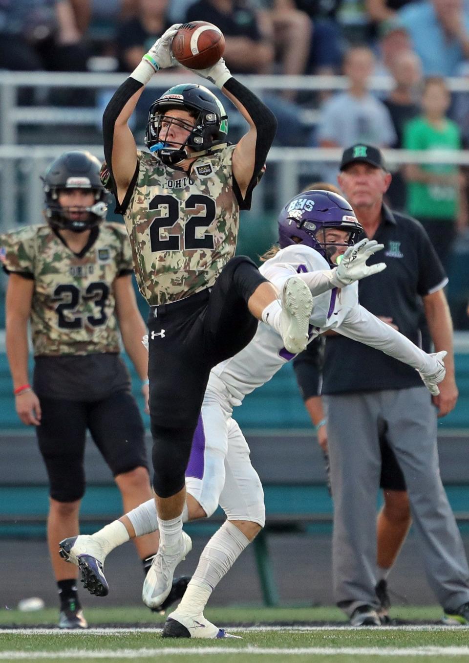 Highland safety Creed Hill picks off a pass intended for Barberton wide receiver Hayden Macko, Friday, Sept. 17, 2021.