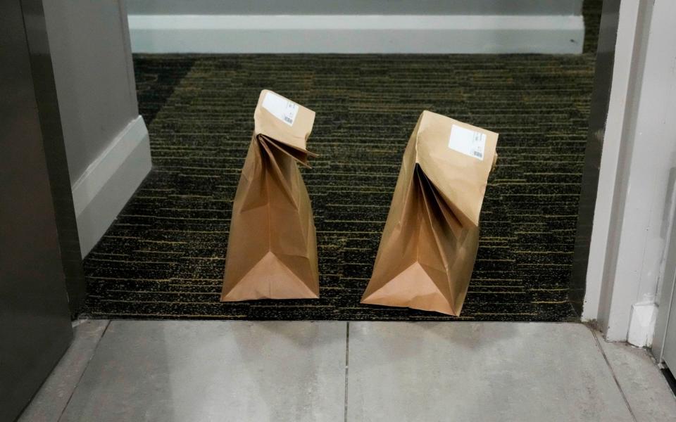 Meals delivered to a quarantine hotel room in Sydney, Australia, where a 14-day stint costs AUD$3,000 (£1,600) per adult traveller - Mark Baker / AP