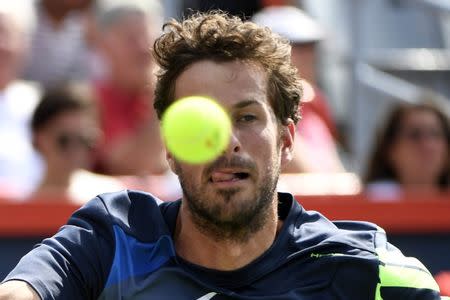 Aug 12, 2017; Montreal, Quebec, Canada; Robin Haase of the Netherlands hits a forehand against Roger Federer of Switzerland (not pictured) during the Rogers Cup tennis tournament at Uniprix Stadium. Mandatory Credit: Eric Bolte-USA TODAY Sports