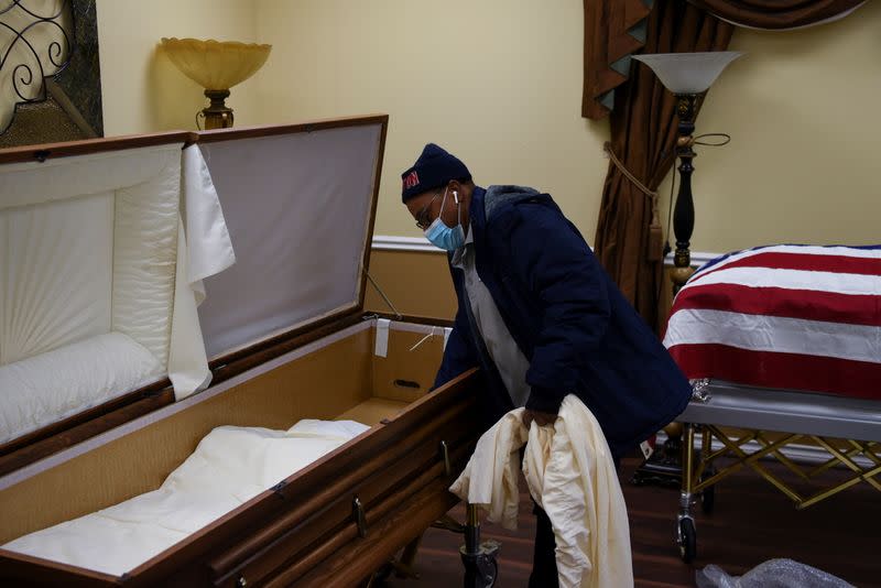 The Wider Image: 'I just ask God to help me': Texas funeral home crushed by death as U.S. COVID toll nears 500,000