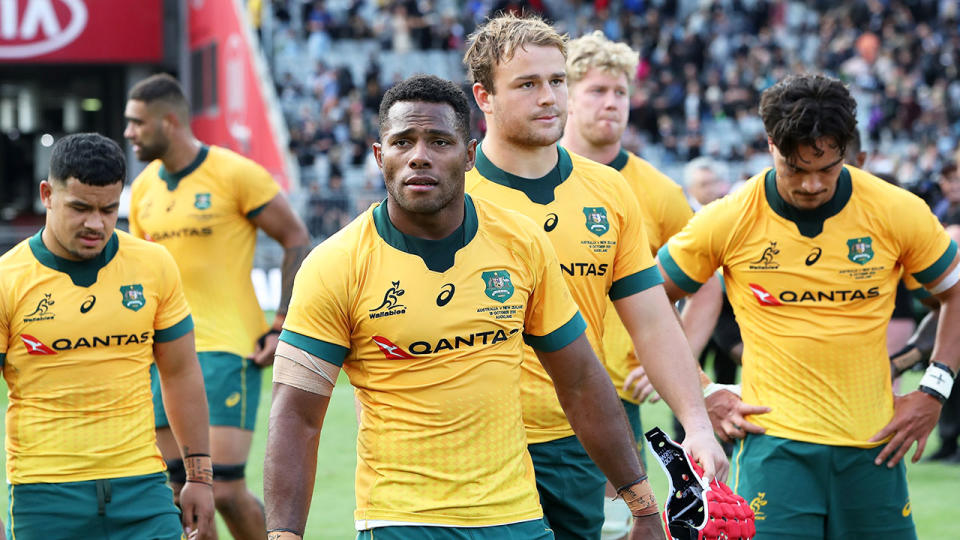 Pictured here, Wallabies players look dejected after another Eden Park mauling by the All Blacks.