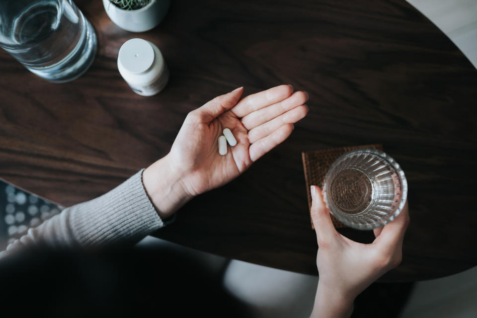 A new mother makes the decision to stop taking her antidepressants (Image via Getty Images). 