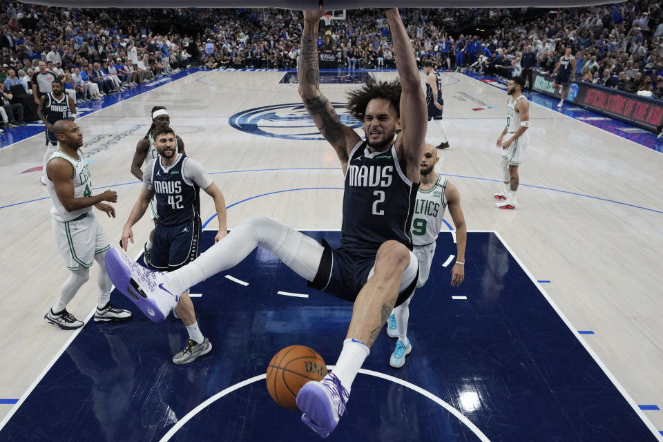 Dallas Mavericks center Dereck Lively II (2) scores against the Boston Celtics during Game 4 of the NBA basketball finals, Friday, June 14, 2024, in Dallas. (Stacy Revere/Pool Photo via AP)