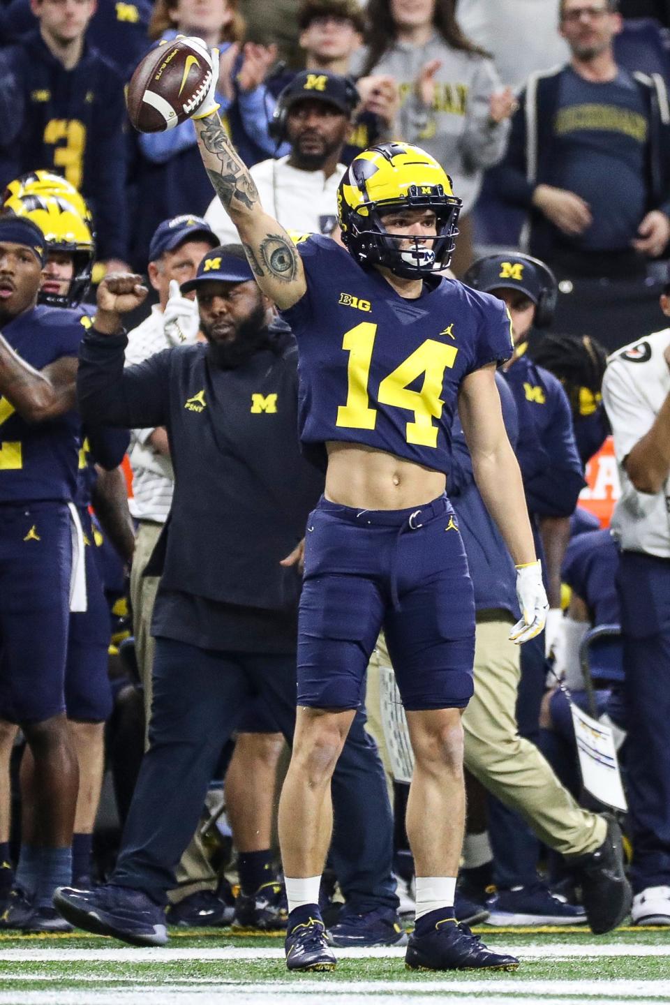 Michigan wide receiver Roman Wilson celebrates a first down against Purdue during the first half of the Big Ten championship game on Saturday, Dec. 3, 2022, in Indianapolis.