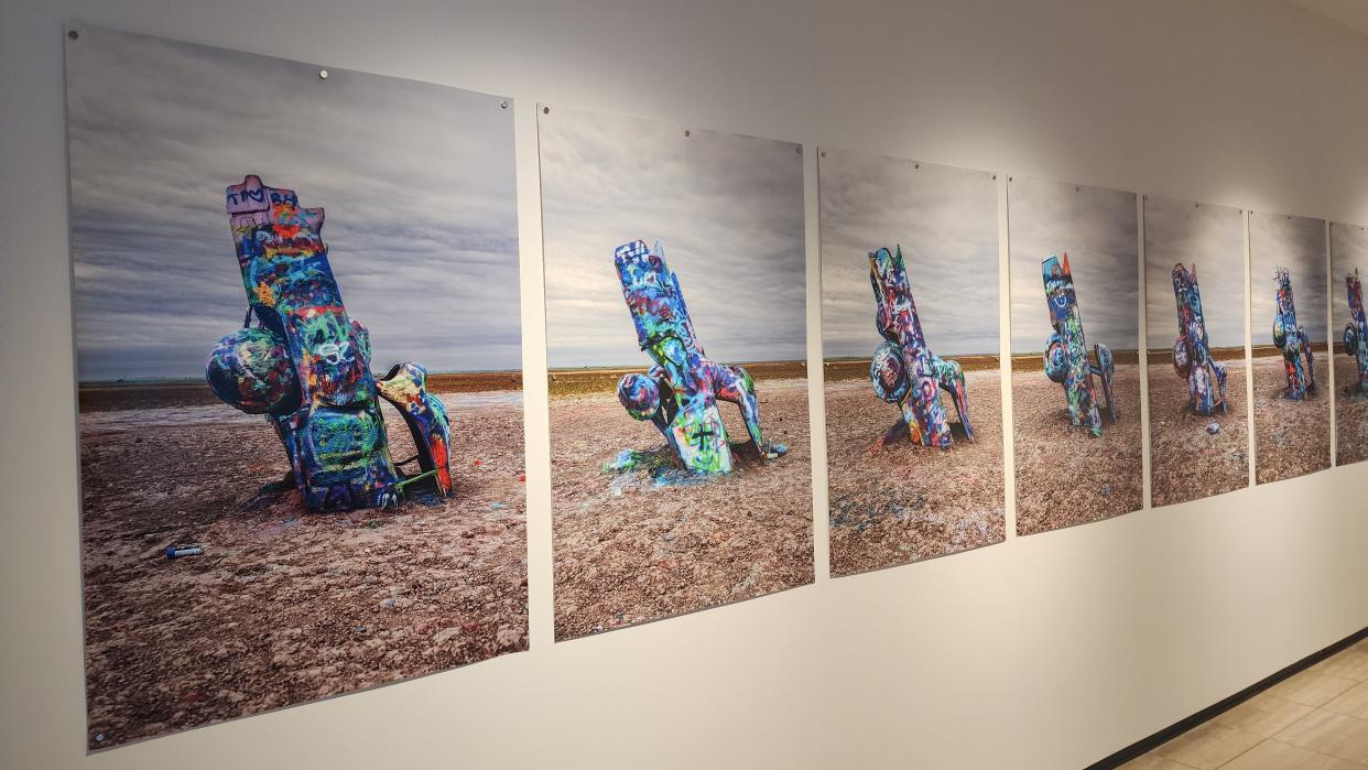 Photos from the "Cadillac Ranch at 50" exhibition are seen at the Amarillo Museum of Art.