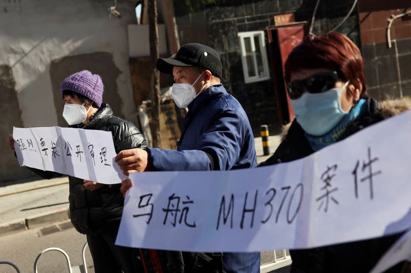 Family members of passengers on Malaysia Airlines flight MH370 that went missing in 2014, in Beijing