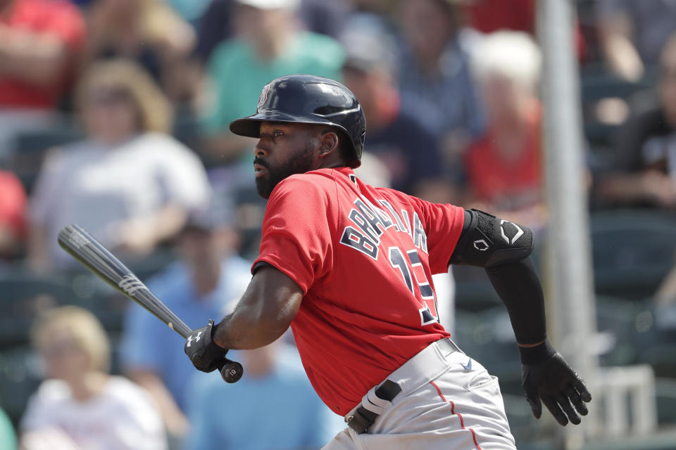 Boston Red Sox' Jackie Bradley Jr. runs to first base after hitting a single in the third inning of a spring training baseball game against the Minnesota Twins Monday, Feb. 24, 2020, in Fort Myers, Fla. (AP Photo/John Bazemore)