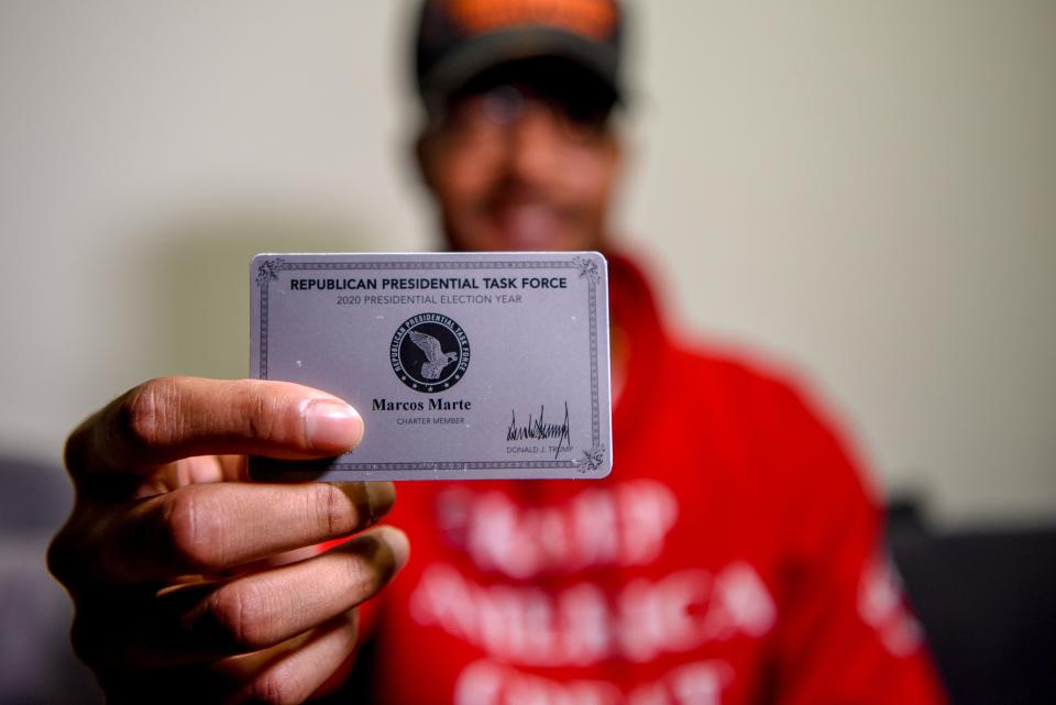 Marcos Marte is a former Bernie Sanders supporter, but now backs Donald Trump for the 2020 election. Marte likes Trump's stance on immigration and the economy and feels he is good for the Latino community. Marte holds up his Republican Presidential Task Force card for a photo in Union City on Tuesday October 13, 2020. 