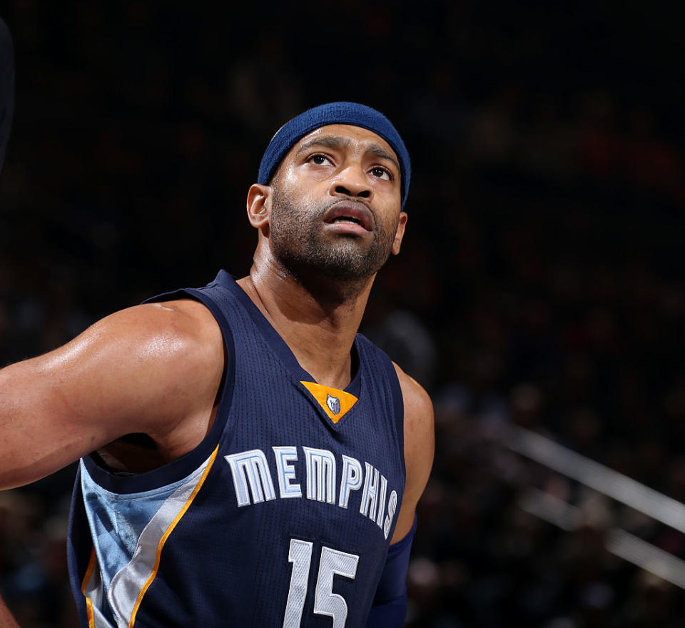 Vince Carter can't believe they keep putting the rim farther and farther away from him. (Getty Images)