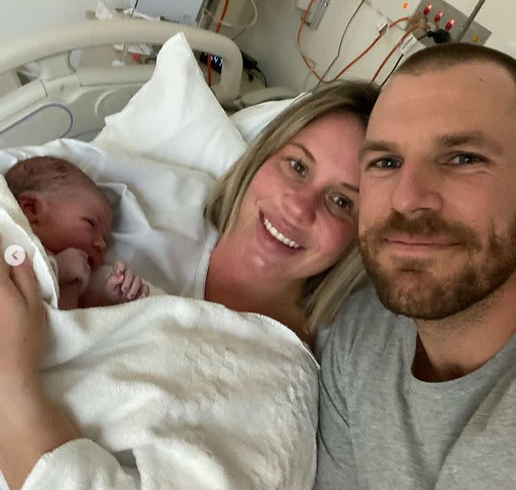 Aaron and Amy Finch with their newborn Esther Kate. Photo- Instagram