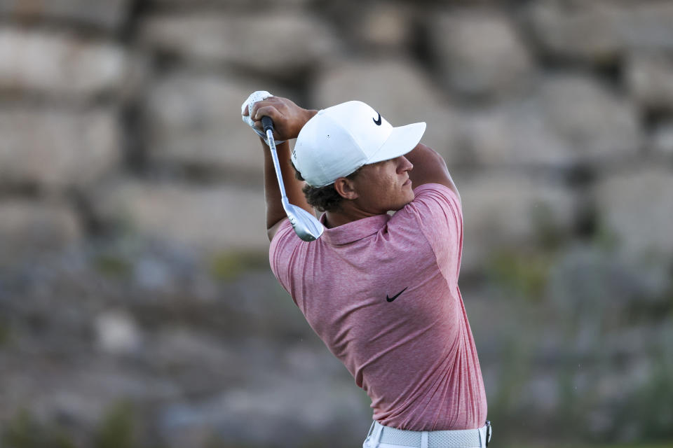 Cameron Champ follows through with his shot from the fairway on the 18th hole during the first day of the Shriners Children's Open golf tournament, Thursday, Oct. 12, 2023, in Las Vegas. (AP Photo/Ian Maule)
