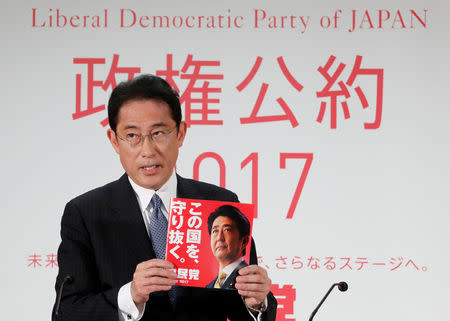 FILE PHOTO : Japan's ruling Liberal Democratic Party (LDP) policy chief Fumio Kishida unveils the party's election campaign platform during a news conference at the LDP's headquarters in Tokyo, Japan October 2, 2017. REUTERS/Kim Kyung-Hoon/File Photo