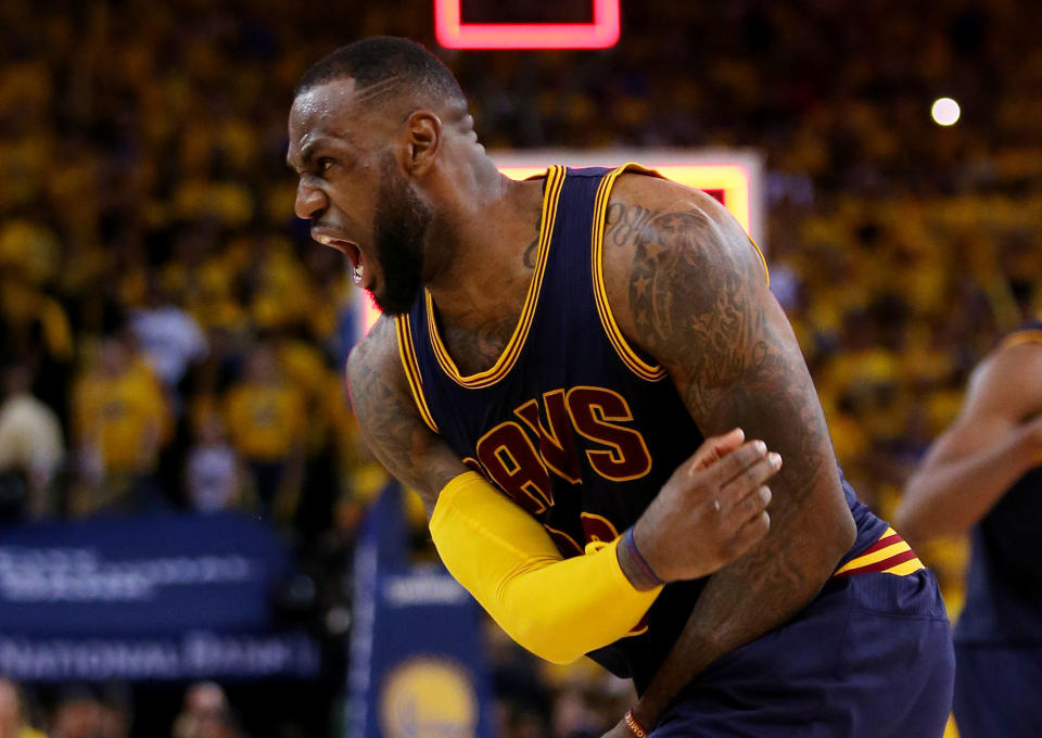 OAKLAND, CA - JUNE 07:  LeBron James #23 of the Cleveland Cavaliers celebrates their 95 to 93 win over the Golden State Warriors in overtime  during Game Two of the 2015 NBA Finals at ORACLE Arena on June 7, 2015 in Oakland, California. NOTE TO USER: User expressly acknowledges and agrees that, by downloading and or using this photograph, user is consenting to the terms and conditions of Getty Images License Agreement.  (Photo by Ezra Shaw/Getty Images)