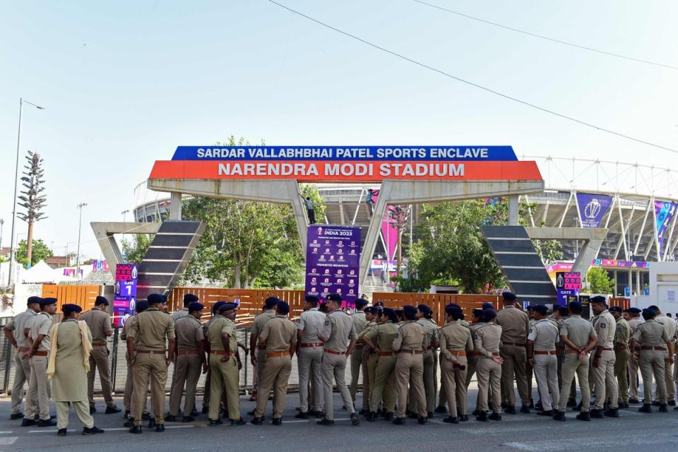 Police personnel gather outside the Narendra Modi Stadium in Ahmedabad on 4 October 2023 ahead of the ICC men's cricket World Cup opening match between England and New Zealand (AFP via Getty Images)