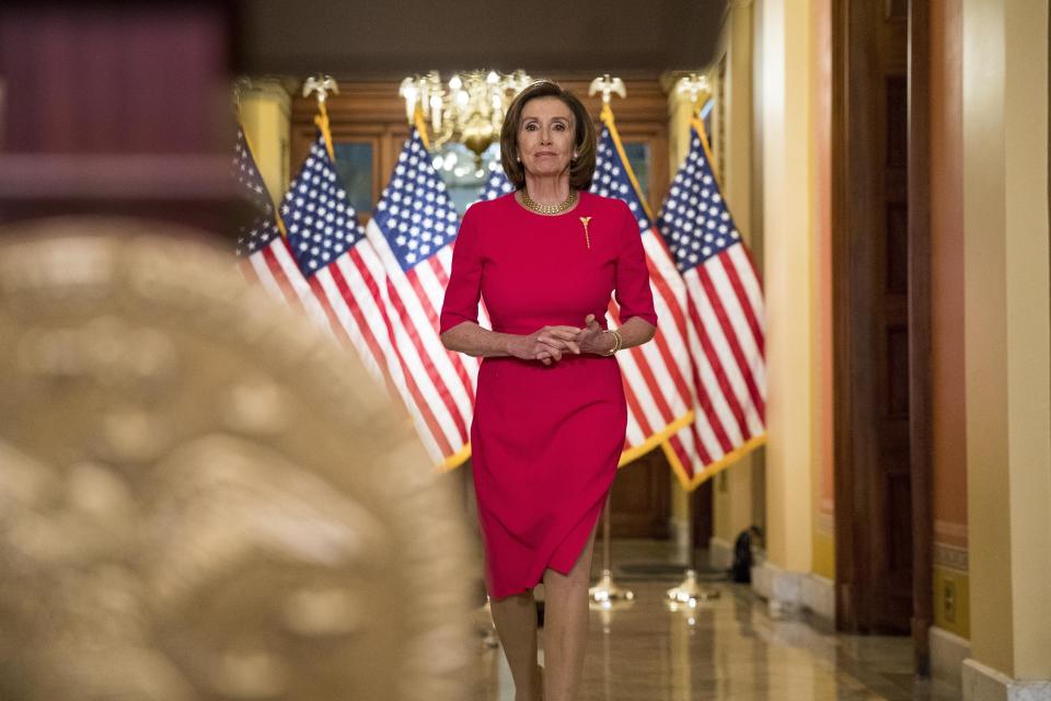 FILE - House Speaker Nancy Pelosi of Calif., arrives to read a statement outside her office on Capitol Hill, Monday, March 23, 2020, in Washington. (AP Photo/Andrew Harnik, Pool, File)