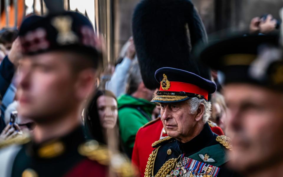 King Charles III looks solemn as the Royal Hearse makes it way from Holyrood Palace to St Giles Cathedral - Chris Strickland/Chris Strickland