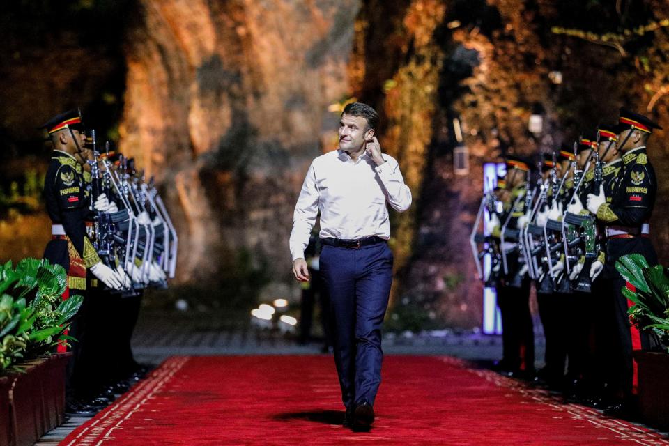 French President Emmanuel Macron walks at the welcoming dinner during the G20 Summit in Badung on the Indonesian resort island of Bali on November 15, 2022. (Photo by WILLY KURNIAWAN / POOL / AFP) (Photo by WILLY KURNIAWAN/POOL/AFP via Getty Images)