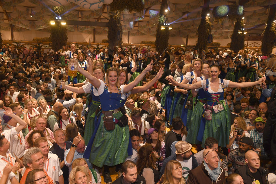 07 October 2018, Bavaria, Munich: Servants dance on the tables in the Hofbräuzelt at the Oktoberfest on the last day of the Wiesn at the Kehraus. The biggest folk festival in the world lasted from 22.09. to 07.10.2018. Photo: Felix Hörhager/dpa (Photo by Felix Hörhager/picture alliance via Getty Images)