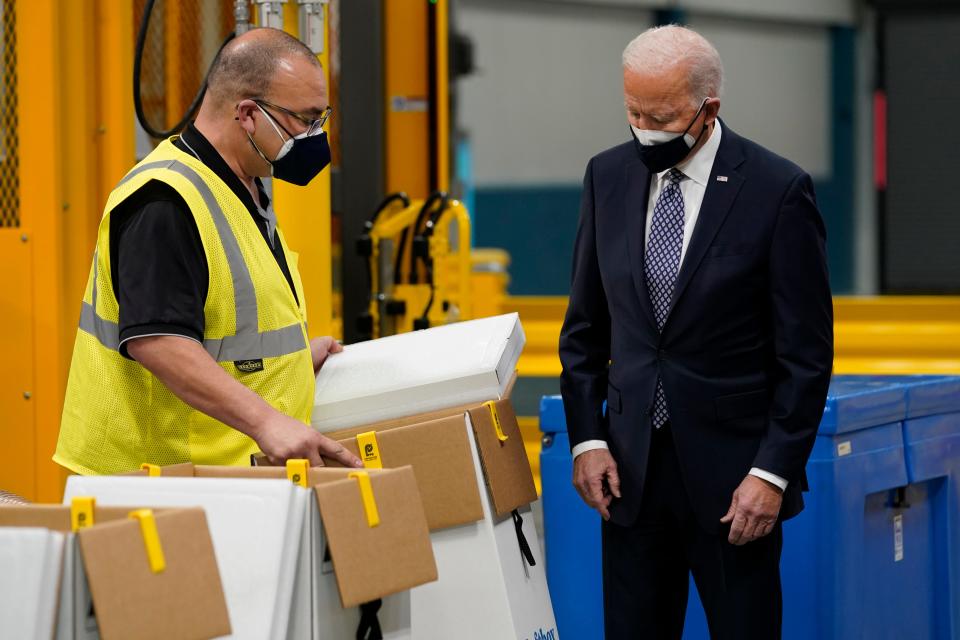 President Joe Biden tours a Pfizer manufacturing site, Friday, Feb. 19, 2021, in Portage, Mich.