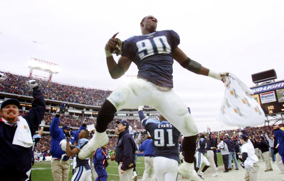 Tennessee Titans defensive end Jevon Kearse (90) leaps in the air as officials ruled that teammates Kevin Dyson kickoff return was a touchdown and they defeated the Buffalo Bills in the AFC Wild Card game Jan. 8, 2000.