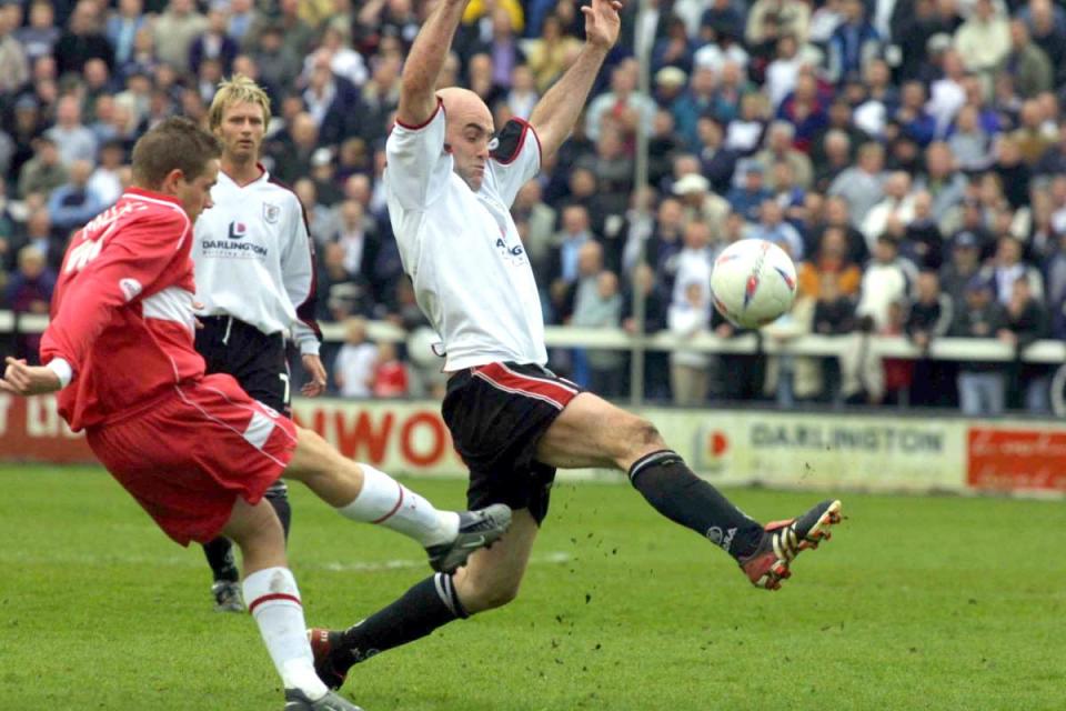 Darlington striker Barry Conlon attempts to block a clearance during Quakers' last match at Feethams in May 2003 <i>(Image: David Wood)</i>