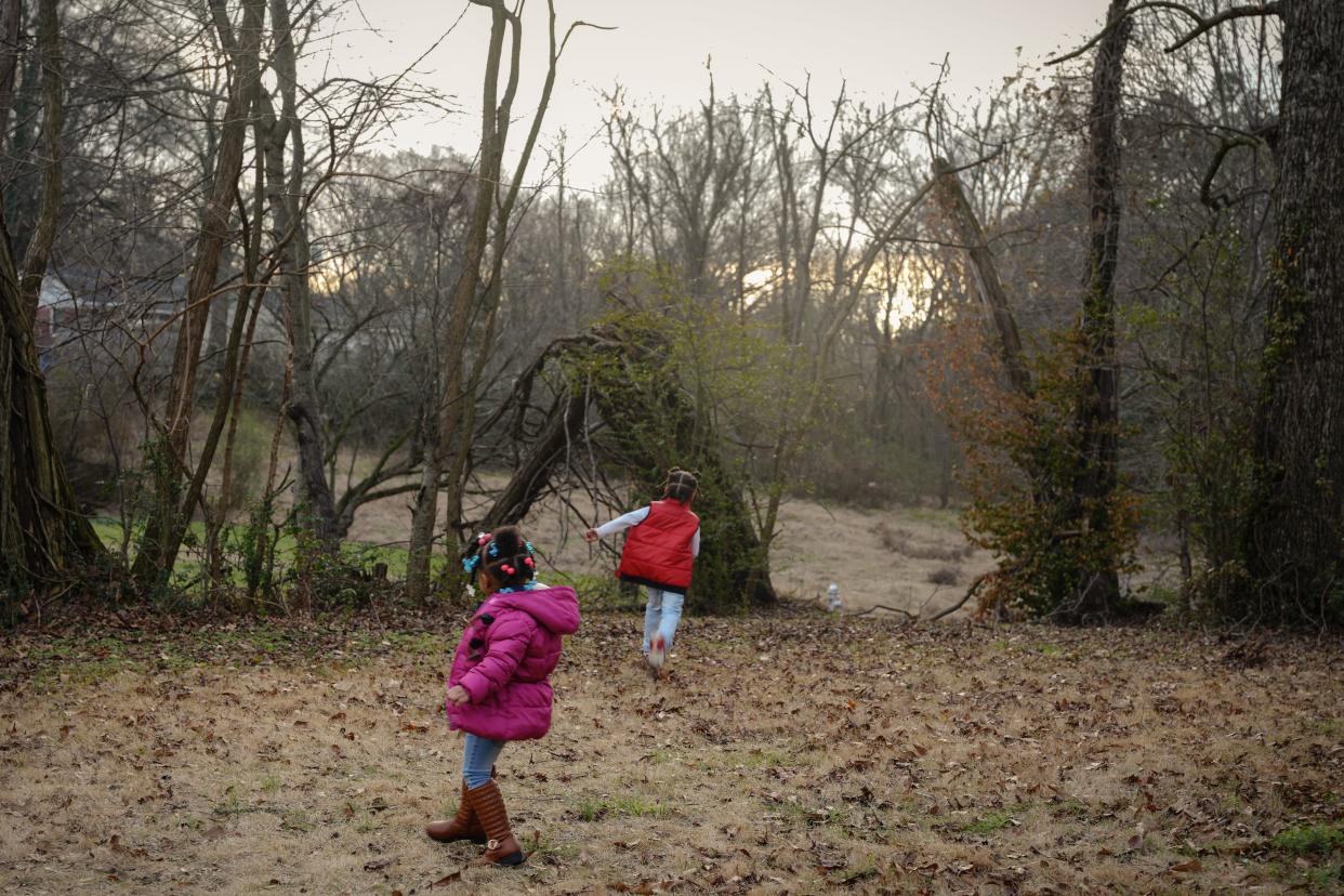MEMPHIS, TN - January 26, 2024: Denedra Levy’s children play in their yard in South Memphis. Levy found out that her children had high levels of lead in their blood that was affecting their health.