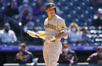 San Diego Padres' Manny Machado casts a glance at Colorado Rockies relief pitcher Mychal Givens after Machado struck out during the seventh inning of the first game of a baseball doubleheader Wednesday, May 12, 2021, in Denver. San Diego won 5-3. (AP Photo/David Zalubowski)