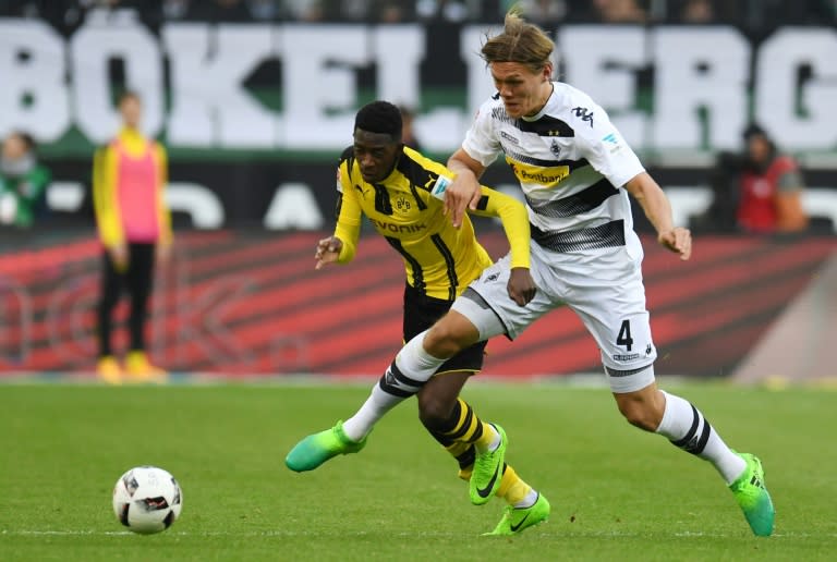 Moenchengladbach's Jannik Vestergaard and Dortmund's Ousmane Dembele vie for the ball during their German first division Bundesliga football match on April 22, 2017