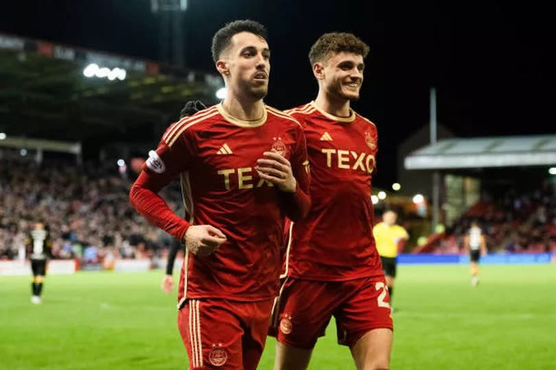 Bojan Miovski and Dante Polvara celebrate after the striker's goal against Livingston