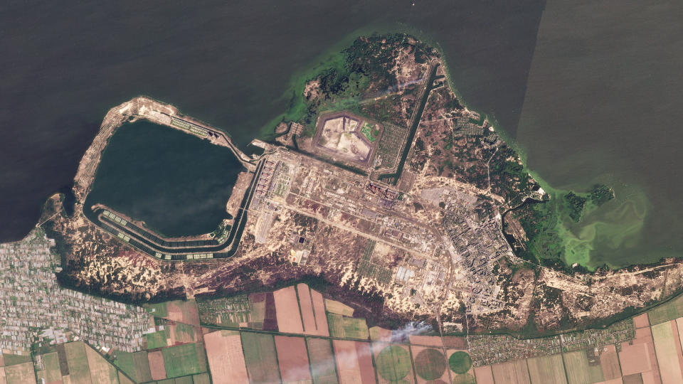 This composite of satellite images taken by Planet Labs PBC shows smoke rising from fires at the Zaporizhzhia nuclear power plant in southeastern Ukraine on Thursday, Aug. 25, 2022. A team from the U.N.'s International Atomic Energy Agency is expected to visit the Russian-occupied Zaporizhzhia nuclear plant in Ukraine soon but more shelling was reported in the area overnight Friday, Aug. 26, 2022. (Planet Labs PBC via AP)