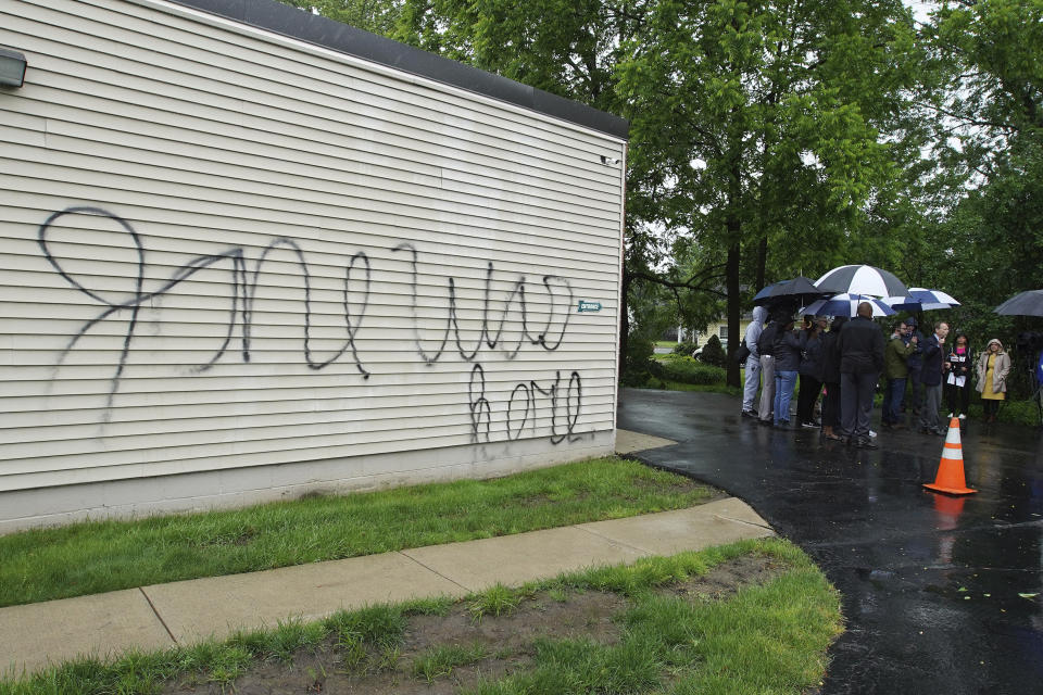 CompassCare President & CEO James Harden, right, speaks to the media after an early morning firebombing at their crisis pregnancy center in Amherst, N.Y., on Tuesday, June 7, 2022. (Mark Mulville/The Buffalo News via AP)